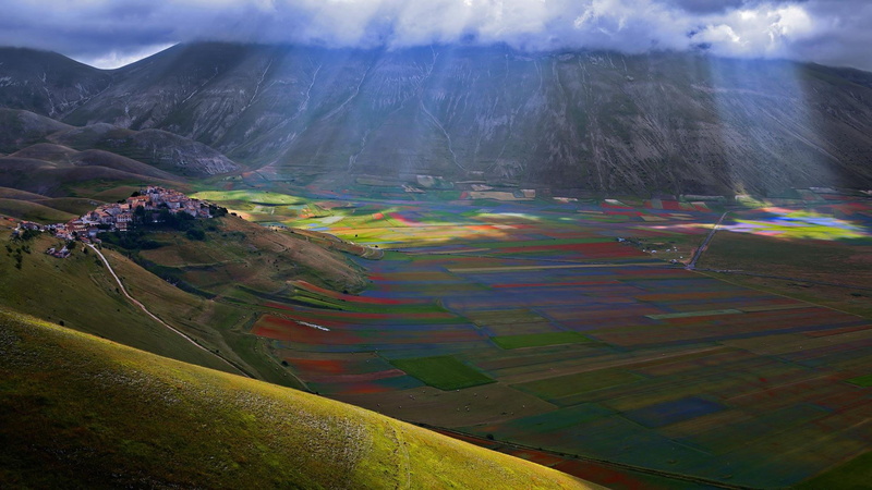 europe, aerial photography, beauty in nature, cloud - sky, plateau, plant, perugia, hill, castelluccio, rays, italy, atmosphere, sunbeam, grassland, plain
