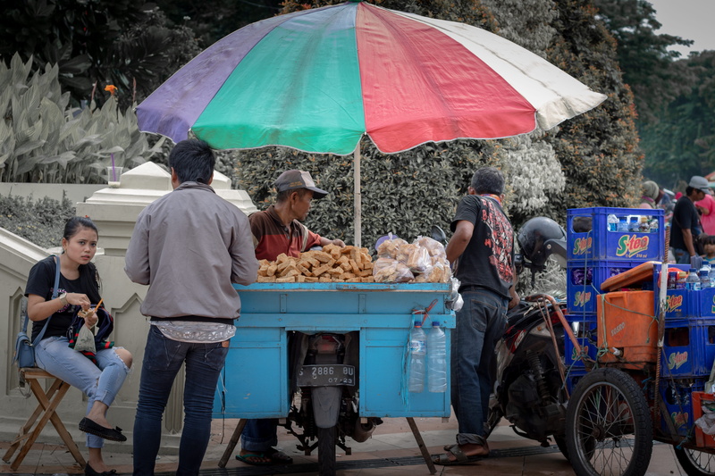 mode of transportation, umbrella, adult, incidental people, day, tree, surabaya, group of people, real people, nature, men, people, outdoors, street photography