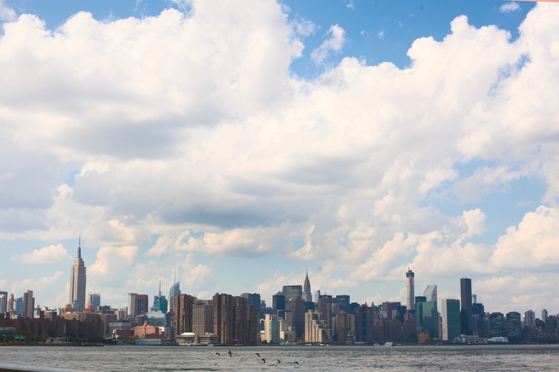 city, meteorological phenomenon, outdoors, panorama, cityscape, downtown, architecture, spire, building, travel destinations, water, office building exterior