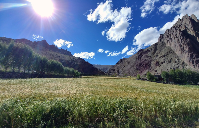 adventure, scenics - nature, 4K, day, landscape, no people, nature, lens flare, extreme, grass, mountain, beauty in nature, sky, field, outdoors, sunlight