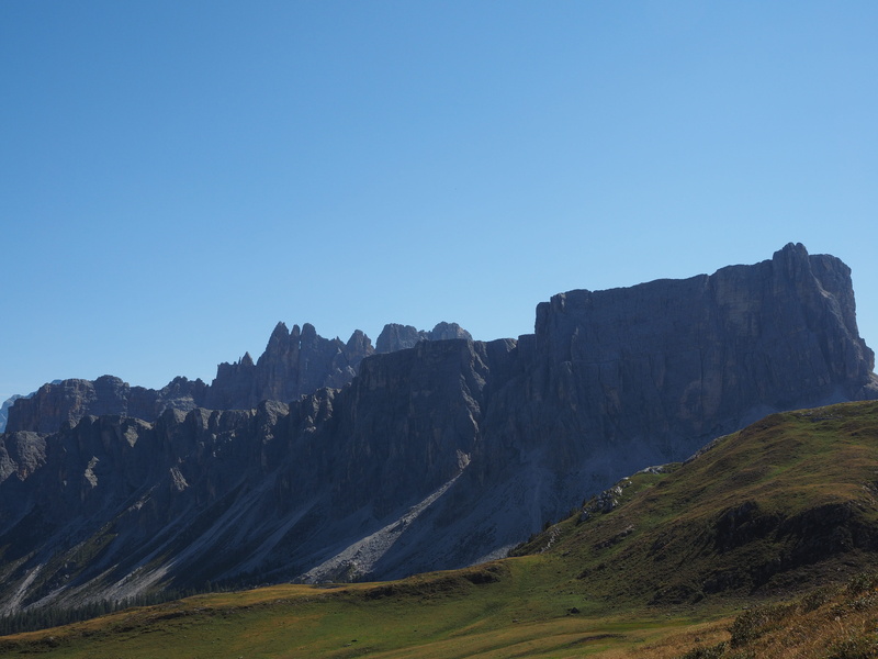 non-urban scene, tranquility, grand diedro, no people, mountain range, environment, remote, passo giau, sky, landscape, rock, mountains, clear sky, nature
