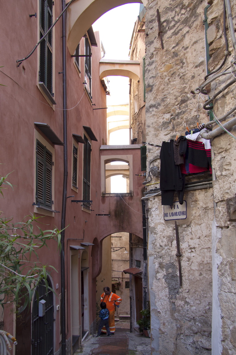 building exterior, lighting equipment, riviera dei fiori, clothing, old, day, communication, history, historically, street, building, outdoors, sanremo