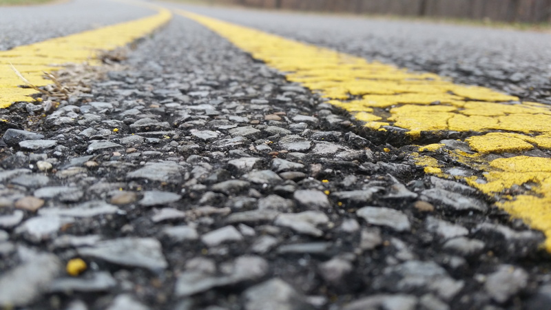 road, yellow, 5K, direction, lines, no people, surface level, black, street, road marking, textured, marking, gravel, city, selective focus, closeup, close-up