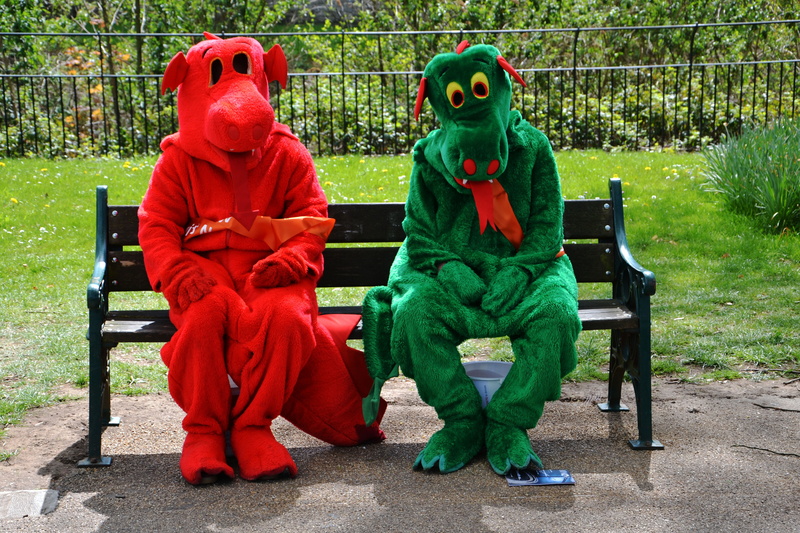 representation, people, men, fun, emotion, lifestyle, colorful, sitting, grass, happy, black, jester, day, party, man, casual, tree, park bench, green color