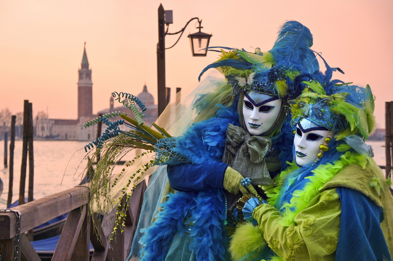 waist up, building exterior, water, tower, traditional clothing, venetian mask, pole, mask, green, celebration, masquerades, carnival - celebration event
