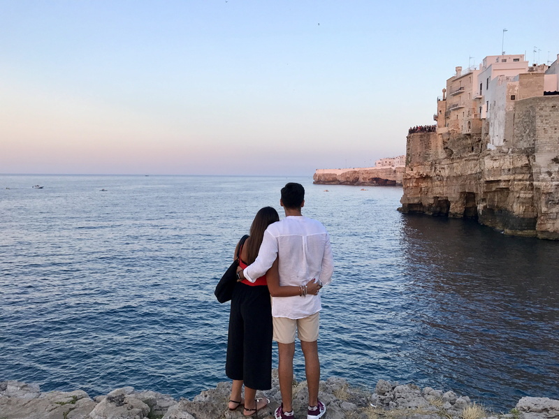 watching, lifestyles, buildings, rocks, puglia, bonding, shirt, calm, horizon over water, sea, daytime, travel, concrete, ocean, tourism, casual clothing