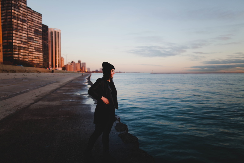 daytime, alone, body, knit, woman, real people, building, seashore, beside, people, horizon over water, tranquil scene, girl, ocean, jacket, side view