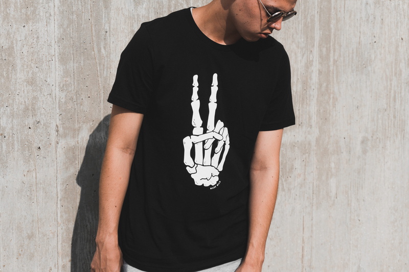 one person, wall, male, standing, young adult, t-shirt, sunglasses, adult, 5K, fresh, model, black color, garment, architecture, fashion, casual clothing