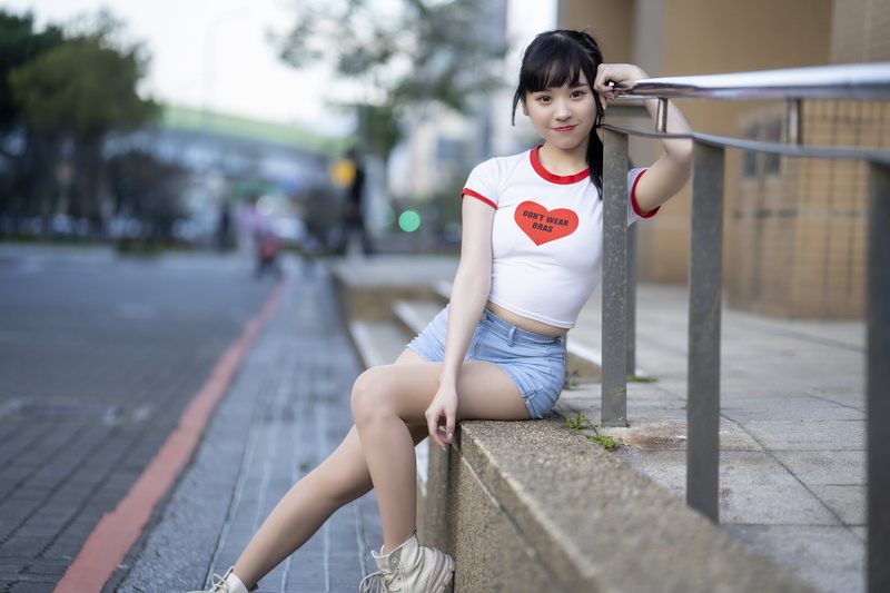women, ponytail, short shorts, 2K, outdoors, brown eyes, Heart (Design), sitting, model, women outdoors, Asian, looking at viewer, railings, brunette