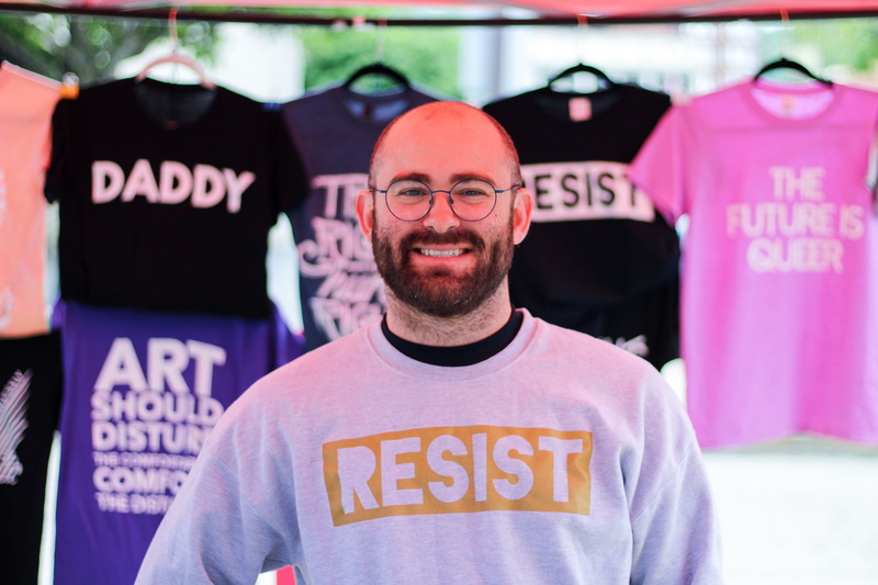 young, focus on foreground, shirts, t-shirts, model, bright, casual clothing, front view, business, assorted, colors, fine-looking, looking at camera, headshot