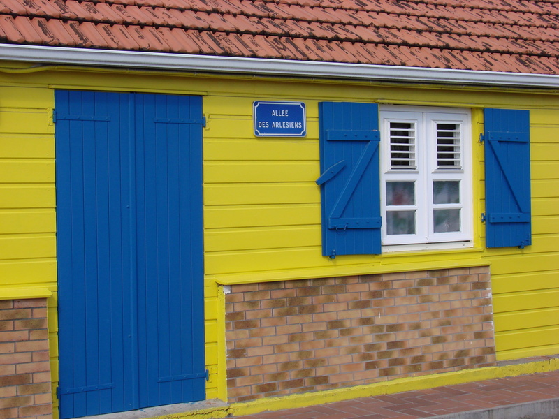 facade, house, blue, brick, closed, building exterior, martinique, text, day, multi colored, no people, building, communication, anses darlet, wall - building feature