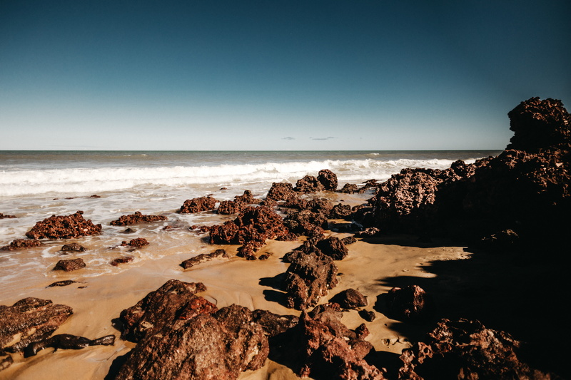  ocean, water, outdoors, tranquil scene, horizon over water, land, landscape, daytime, no people, rocky coastline, azul, rock formation, beach
