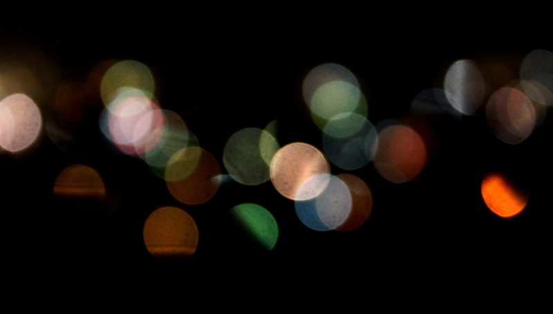 glisten, dark, light - natural phenomenon, focus, projection, round out, black background, abstract backgrounds, defocused, shape, luminescence, light