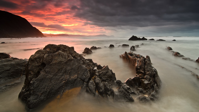 rock formation, rock - object, sunset, non-urban scene, idyllic, tranquility, sky, solid, tranquil scene, land, scenics - nature, no people, cloud - sky