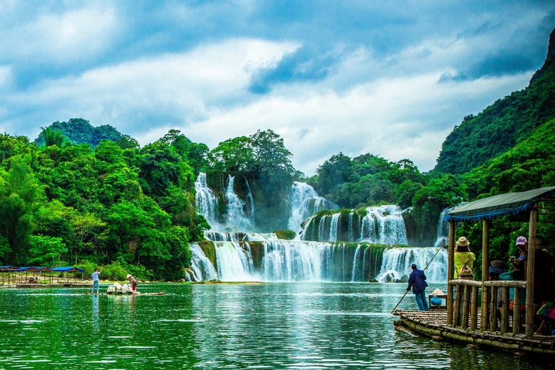 real people, leisure activity, cloud - sky, beauty in nature, waterfall, water, travel destinations, tree, lifestyles, day, motion, flowing water, river