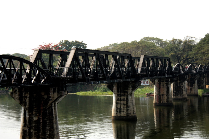 outdoors, tree, prisoners of war, sky, transportation, the bridge over the river kwai, connection, architectural column, bridge, kanchanaburi, water, plant