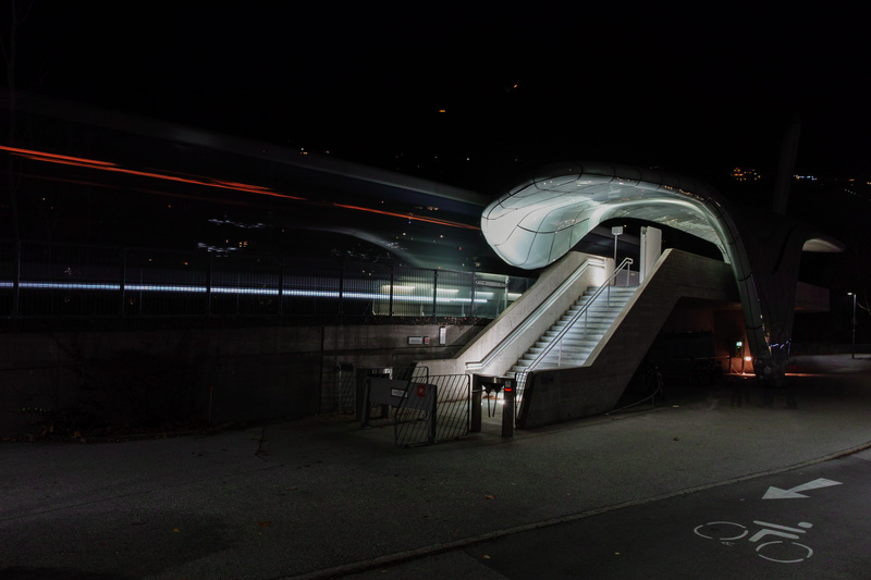 no people, planetarium, nature, metal, pedestrian, motion, lighting, banister, sky, vehicle, city, white, architecture, asphalt, innsbruck, railing, airport