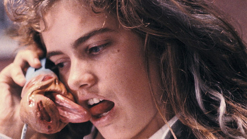 human face, portrait, indoors, young adult, messy, hair, headshot, emotion, food, adult, hairstyle, brown hair, eating, 1080P, looking, a nightmare on elm street 1984