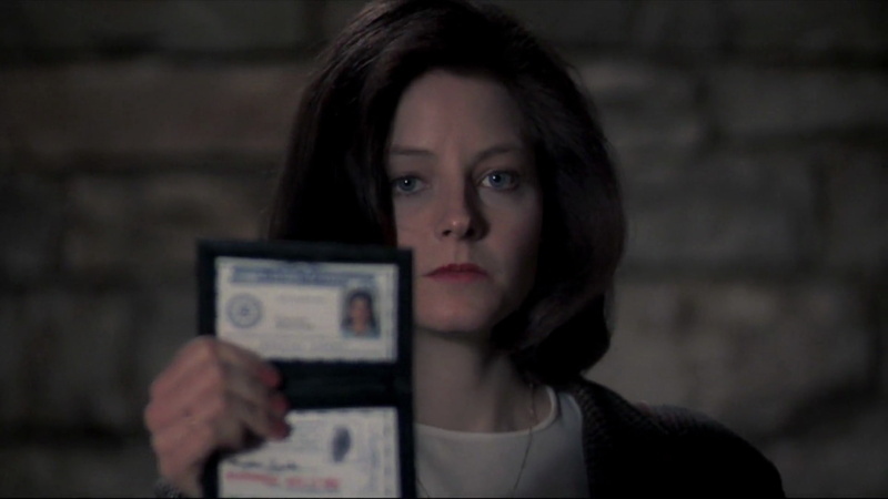 brown hair, front view, one person, indoors, young adult, women, portrait, close-up, hair, The Silence Of The Lambs, Jodie Foster, holding, looking at camera