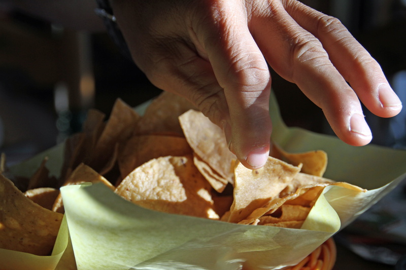 indoors, finger, bakery, food And Drink, bag, Food, one person, lifestyles, nacho chip, California, close-up, San Diego, paper, tortilla, adult, cooking