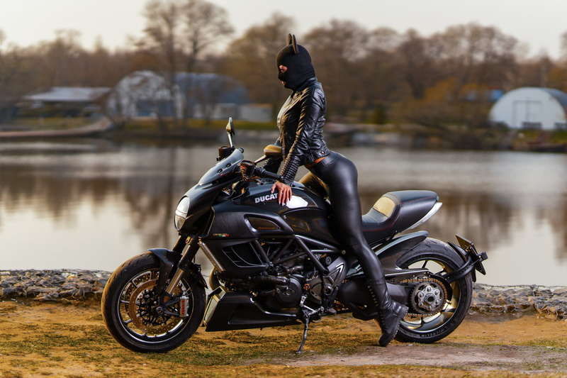 trees, leggings, women outdoors, Ducati, shoes, looking away, leather jackets, 1080P, women with motorcycles, lake, Brembo, black clothing, Ducati Diavel