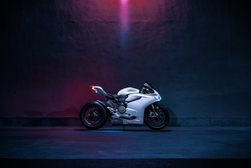 full length, Motorcycle, motor vehicle, illuminated, speed, one person, transportation, driving, land vehicle, crash helmet, adult, side view, indoors