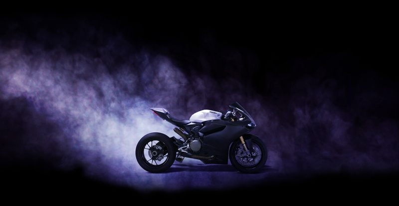 emotion, black background, bikes, motion, excitement, side view, full length, studio shot, one person, smoke - physical structure, mode of transportation