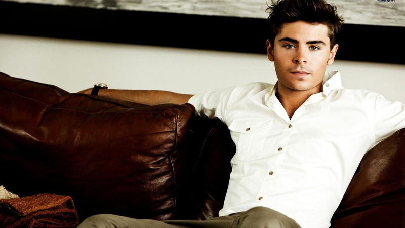 clothing, leather, sitting, luxury, young adult, front view, one person, looking, young men, celebrity, couch, men, looking at camera, relaxation, Zac Efron