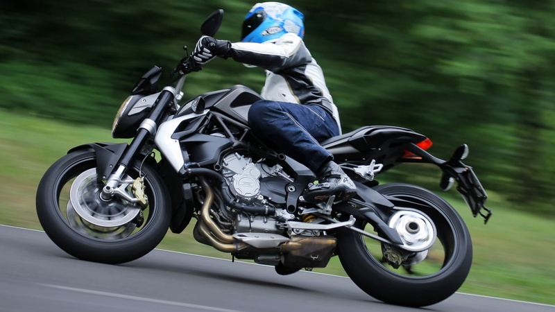 road, motorcycle, land vehicle, extreme sports, sport, riding, helmet, sports helmet, motorized vehicle riding, sports race, transportation, mode of transportation