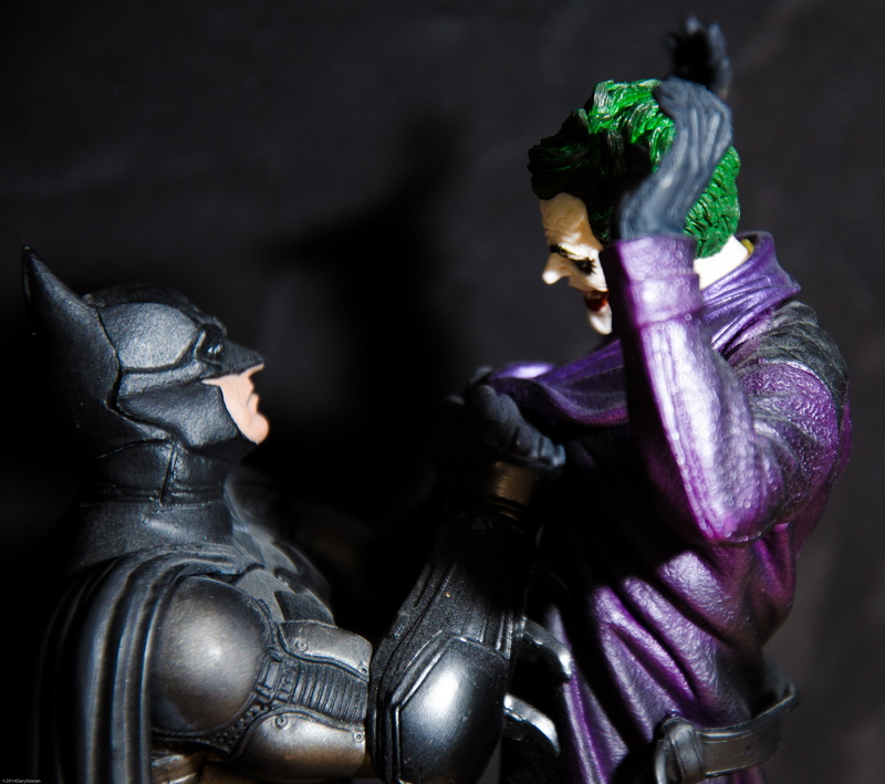 indoors, dark, toy, suit of armor, cartoon, armed forces, no people, craft, sculpture, military, action, batman, figurine, focus on foreground, photo, female likeness