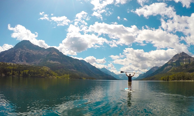 one person, stand up paddle, mountains, national park, mountain, beauty in nature, tranquility, canada, real people, mountain range, waterton park, sup