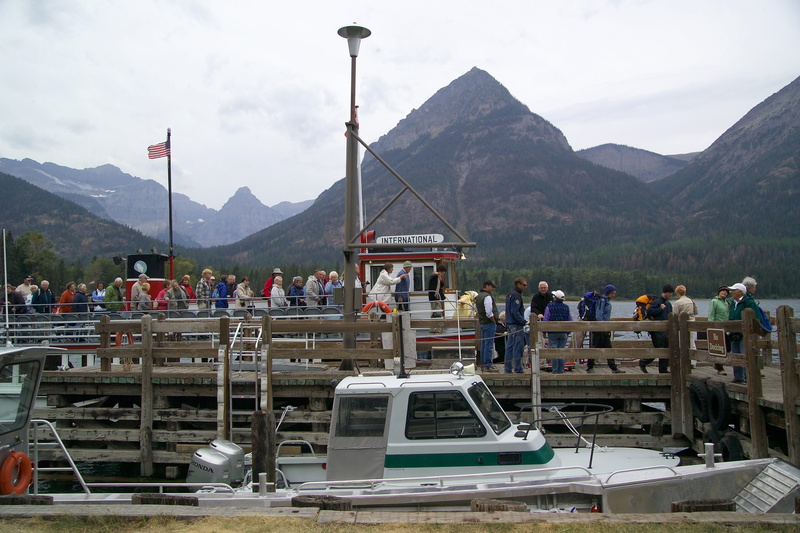 men, real people, adults only, crowd, Waterton Lake, National Park, public domain, water, mountain Range, group of people, boat, boats, women, sky, nautical vessel