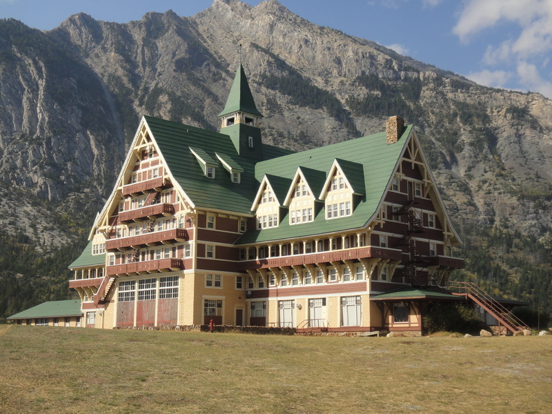 scenery, spirituality, residential district, land, spire, religion, place of worship, belief, built structure, mountain, plant, no people, building exterior