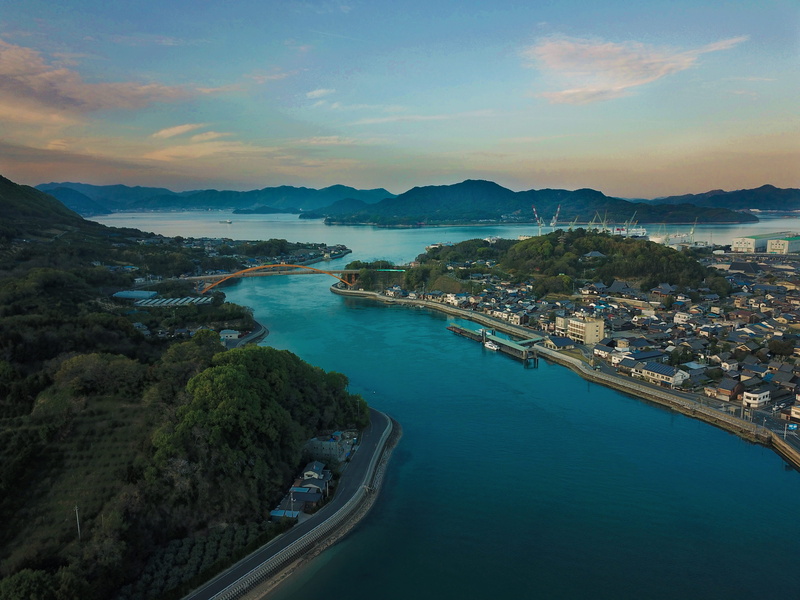 tranquility, mountain range, no people, nature, transportation, outdoors, building exterior, bridge, tranquil scene, drone sunset, built structure, high angle view