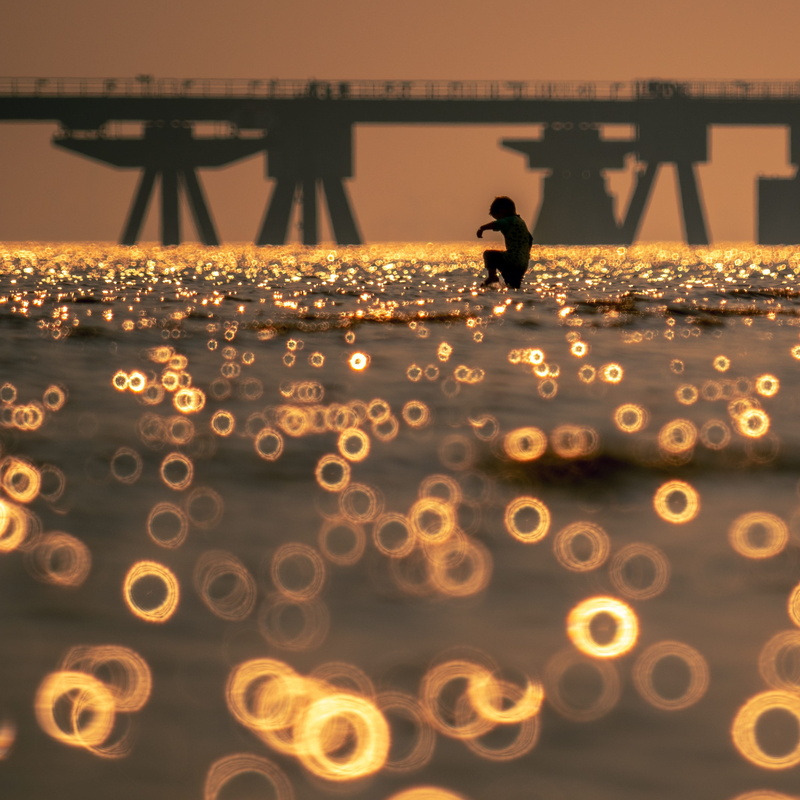 seascape, sky, outdoors, full length, lifestyles, silhouette, motion, 2K, rokkor, one person, balticsea, ocean, built structure, water, orange color, mirrorlens