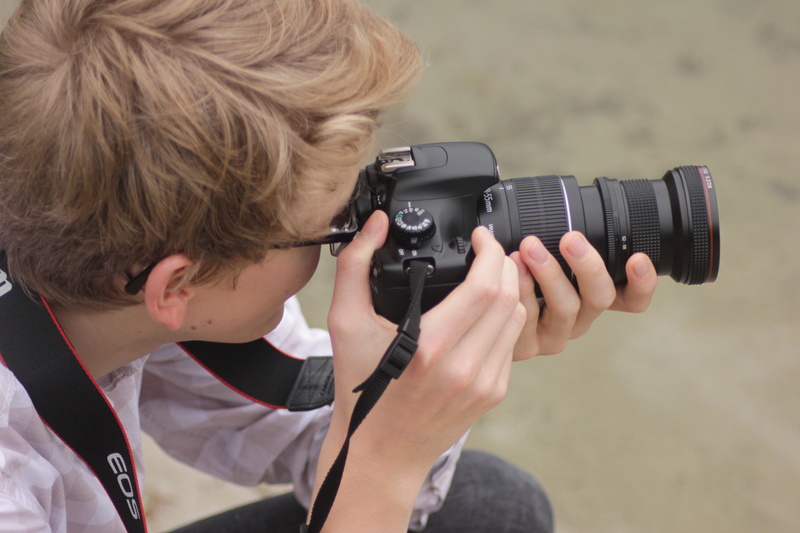 holding, blond hair, camera, digital camera, camera - photographic equipment, focal length, boys, 5K, childhood, child, human, casual clothing, males