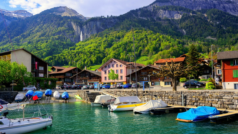 day, architecture, boats, mountain, moored, switzerland, water, swiss alps, interlaken, tree, outdoors, building exterior, europe, waterfront, house, plant
