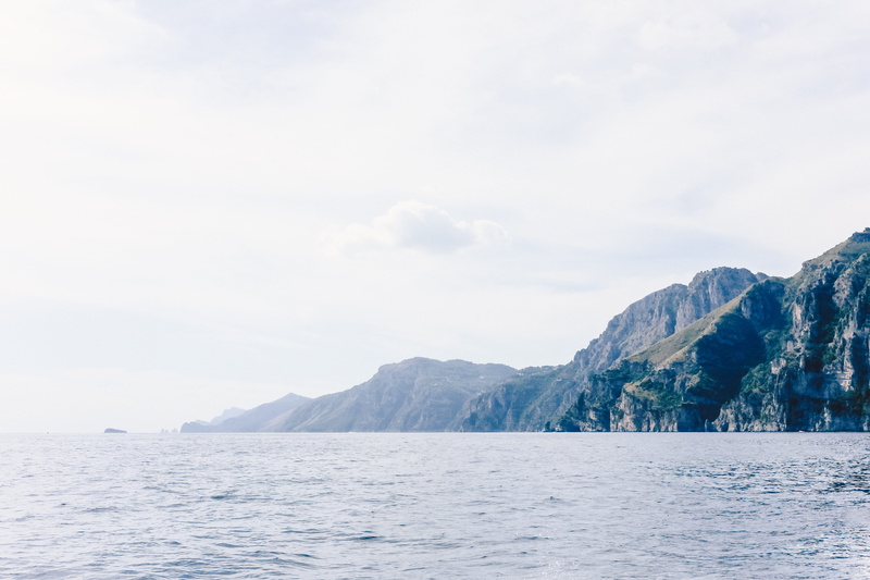 positano, tranquility, idyllic, cloud - sky, amalfi, no people, mountain, remote, non-urban scene, formation, beauty in nature, mountain range, tranquil scene