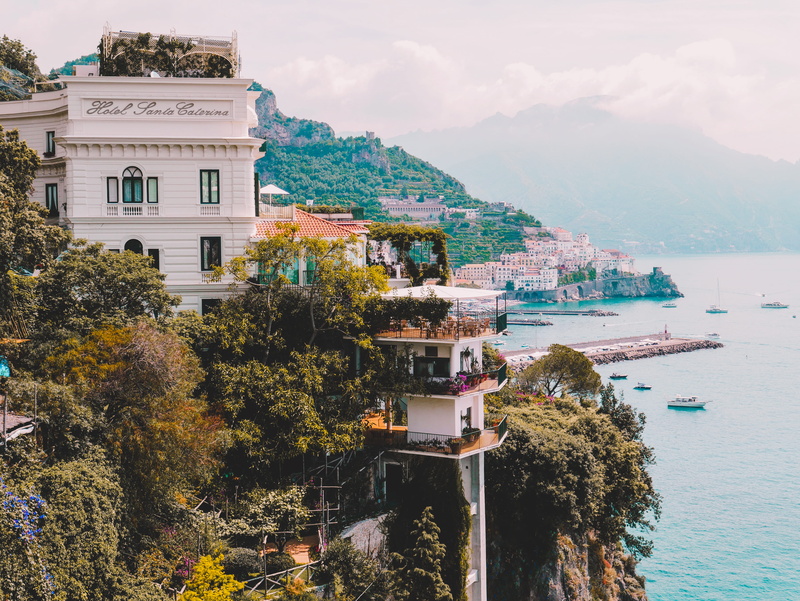 town, water, boats, santorini, mountain, sea, residential district, amalfi coast, building, dock, outdoors, cloud - sky, port, landscape, land, nature