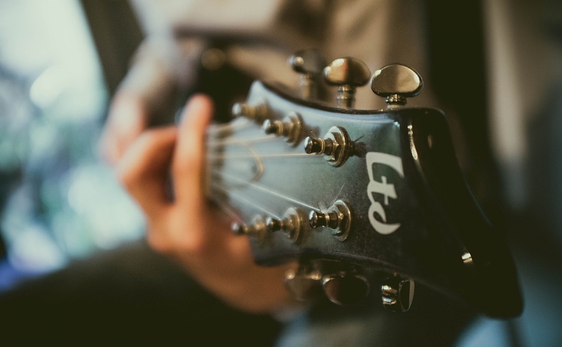 headstock, close-up, technology, hand, sound, occupation, playing, one person, indoors, ltd, men, holding, dusty, focus on foreground, selective focus