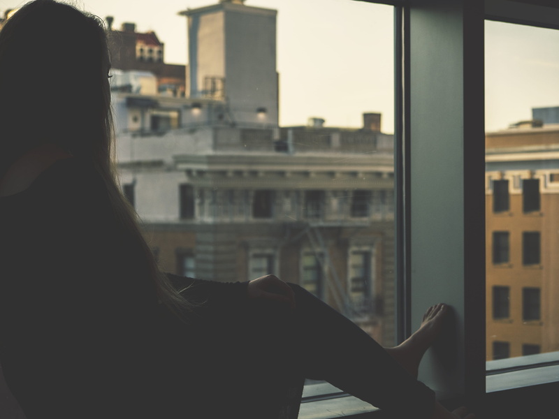 glass - material, transparent, model, city, built structure, cityscape, sitting, rear view, looking, lifestyles, beside, one person, black, day, building