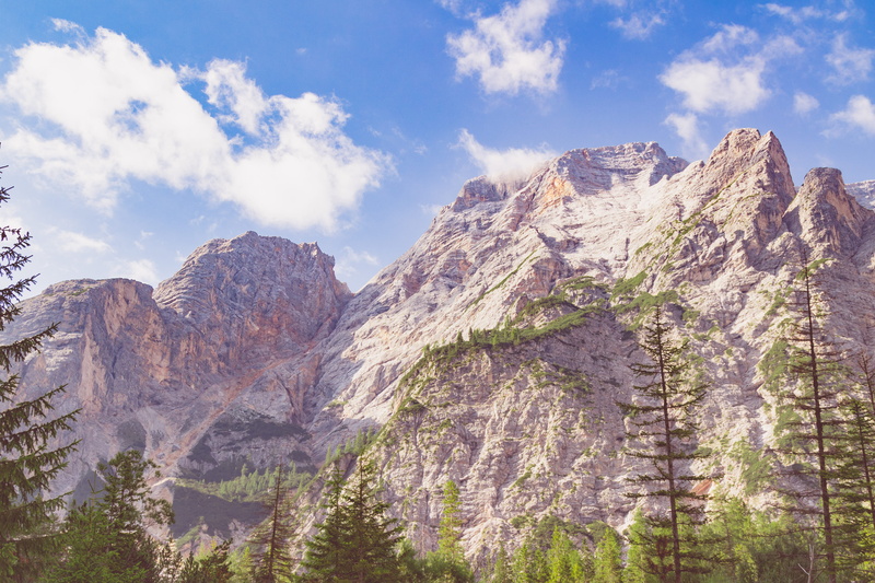 pine woodland, rock - object, tree, peak, pine tree, travel destinations, tranquil scene, sky, mountain range, cloud - sky, lago di braies, formation, blue