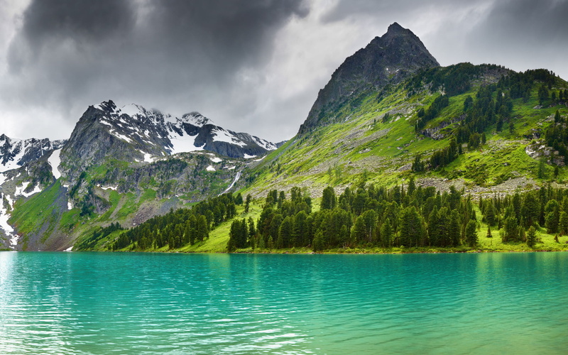 blackclouds, outdoors, tranquil scene, idyllic, sky, thick, beauty in nature, cloud - sky, mountain peak, plant, non-urban scene, waterfront, reflection