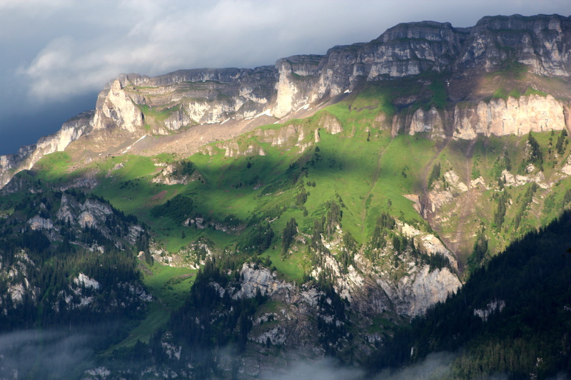 eroded, mountain range, sun, solid, cloud - sky, tranquility, no people, formation, light, outdoors, green, mountain peak, alpine, mountain, non-urban scene