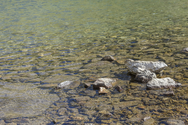 rock, tranquil scene, shallow, sea, waterfront, no people, non-urban scene, nature, solid, beauty in nature, land, switzerland, beach, day, sunlight, interlaken