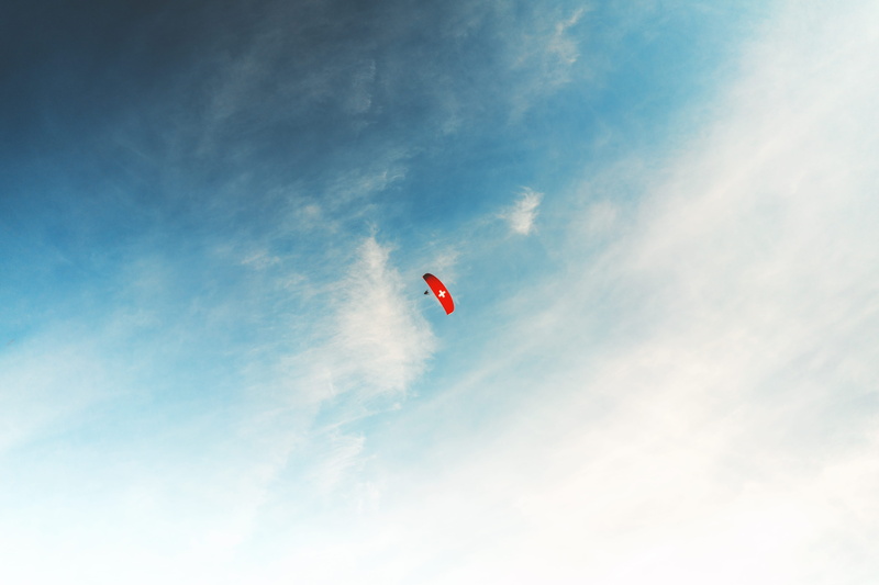day, tranquility, flying, cloud - sky, beauty in nature, nature, tranquil scene, freedom, interlaken, scenics - nature, adventure, leisure activities, red