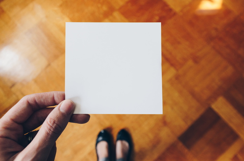 square, shoe, marketing, person, human hand, table, wood - material, template, design, placeholder, unrecognizable person, card, hold, white, body part