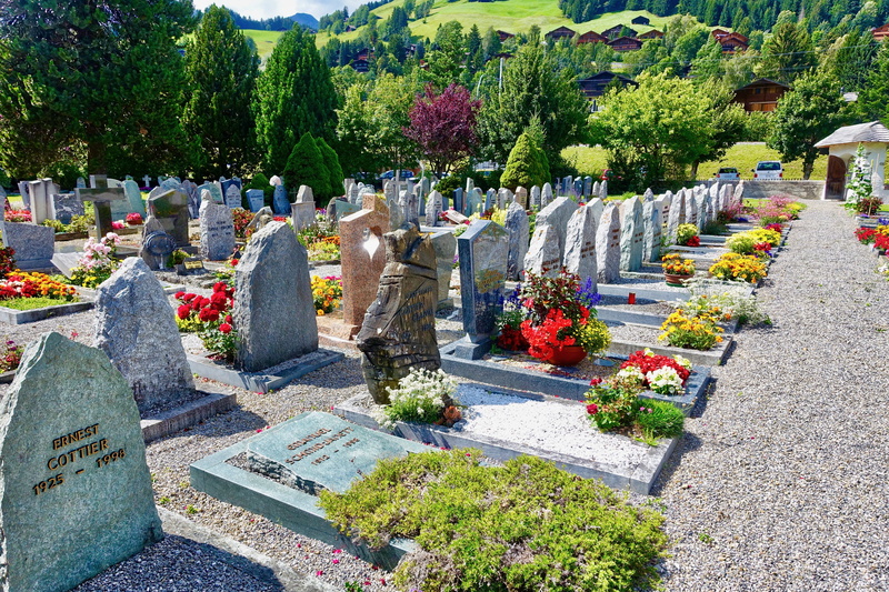 solid, graveyard, decoration, tombs, religion, celebration, no people, flowers, stone, flowering plant, cemetery, headstones, sunlight, flower, grave, gravestones