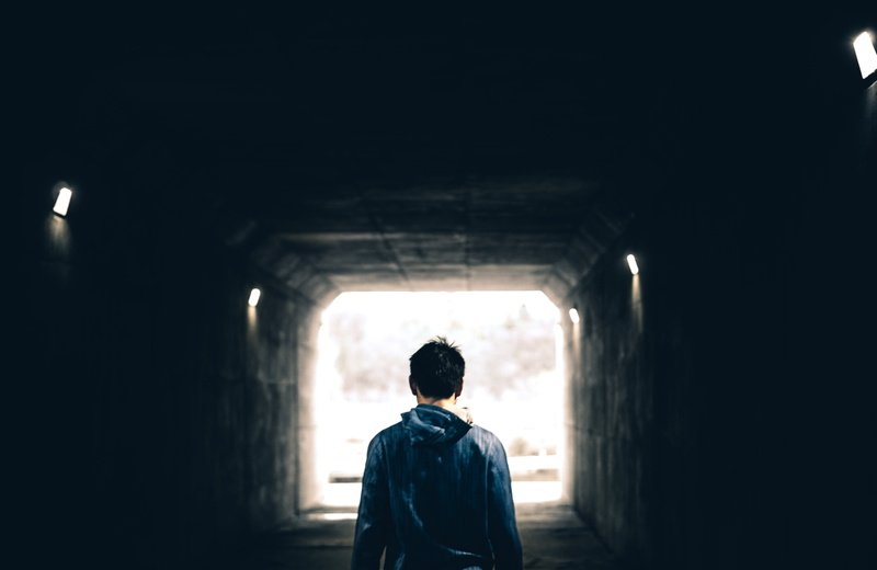outdoors, tunnel, light at the end of the tunnel, one person, dark, architecture, indoors, wall - building feature, real people, day, light, person, nature