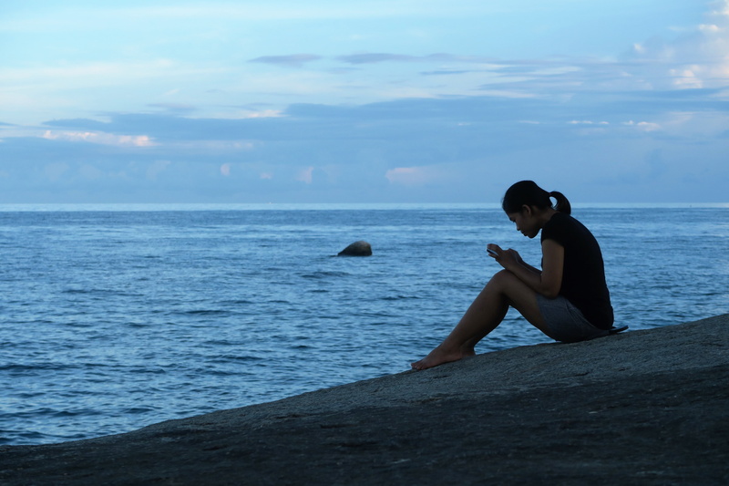horizon over water, outdoors, girl, one person, nature, solitude, beauty in nature, rock, woman, real people, seashore, full length, horizon, sitting, beside